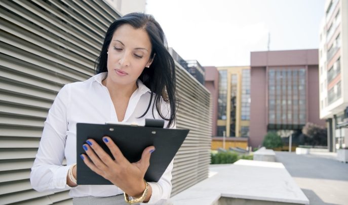 Women with clipboard, representing Ofsted and SEND