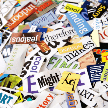 Ambitious vocabulary words cut out of magazines