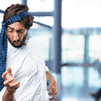 Teacher dancing with tie round head
