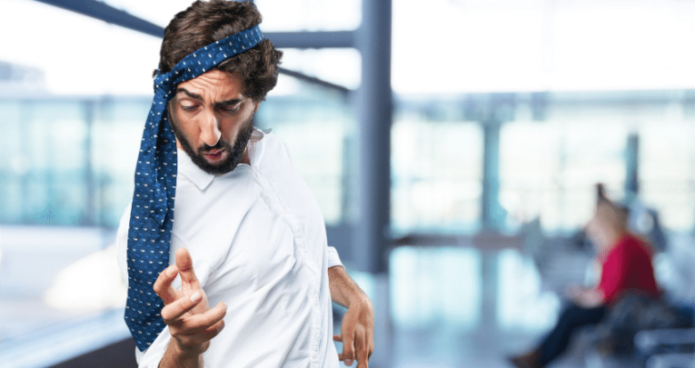 Teacher dancing with tie round head