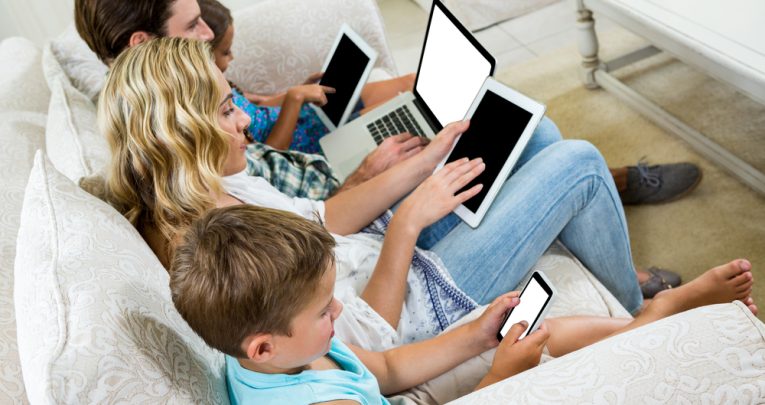 Family on different devices, representing children's screen time