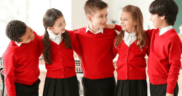 Schoolchildren in uniform doing icebreaker games