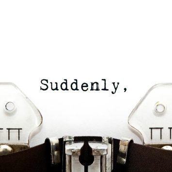 The word 'Suddenly' typed on a typewriter, representing fronted adverbials