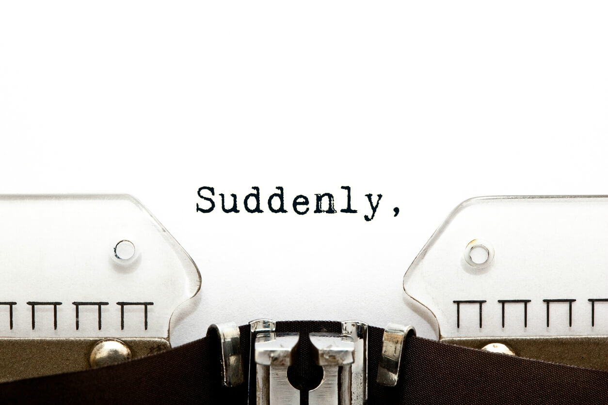 The word 'Suddenly' typed on a typewriter, representing fronted adverbials