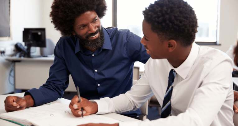 Teacher helping student with GCSE English Language revision