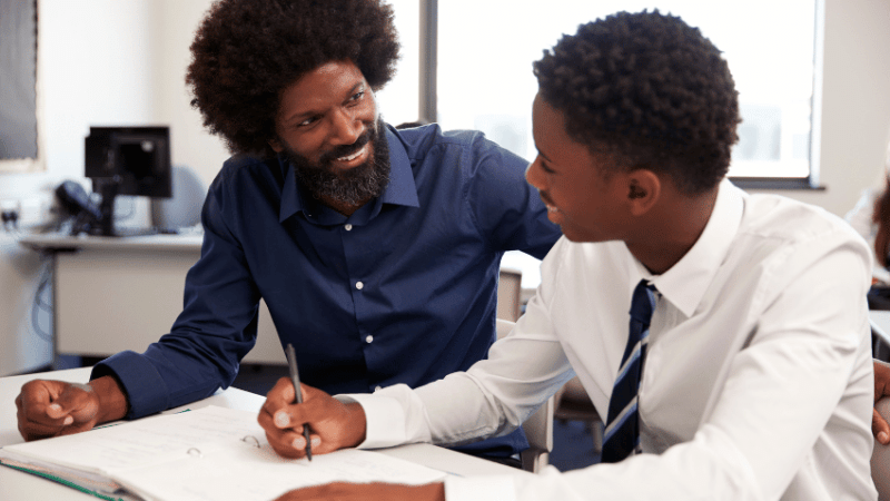 Teacher helping student with GCSE English Language revision