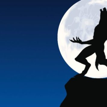 Werewolf silhouette in front of full moon