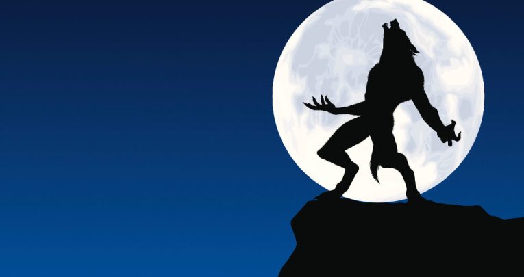 Werewolf silhouette in front of full moon