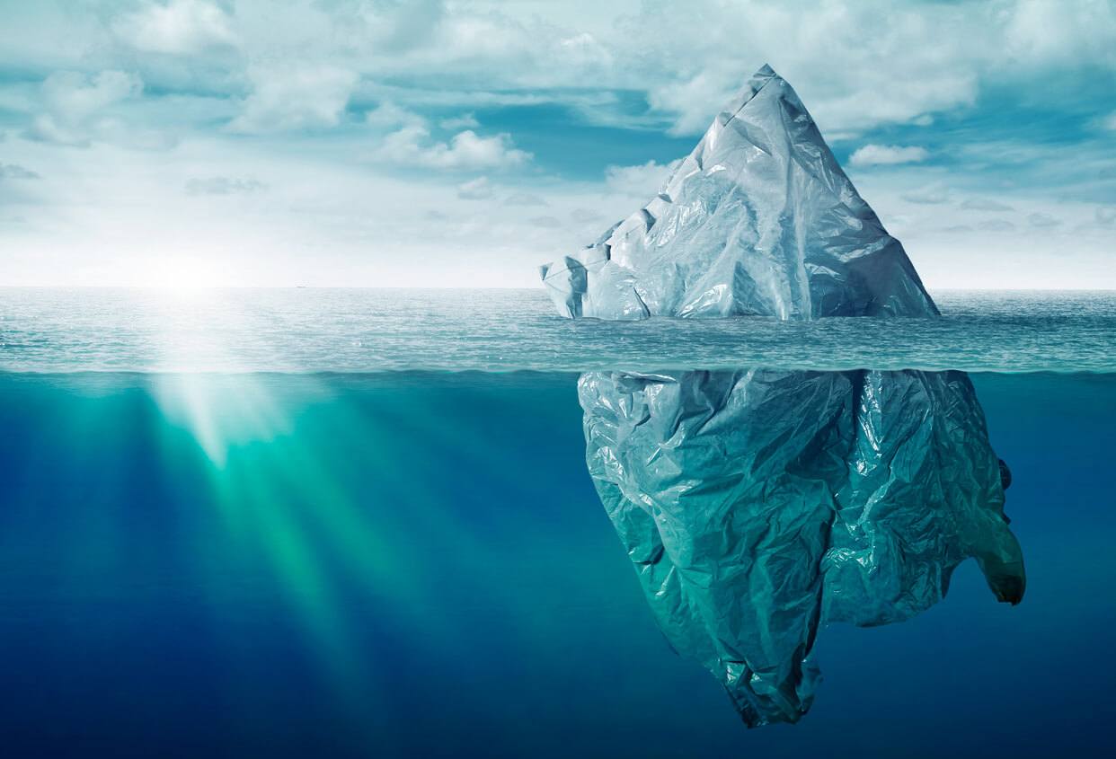 Iceberg seen above and below waves, representing World Ocean Day activities