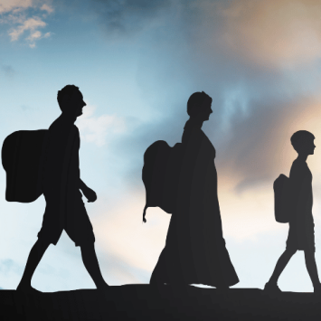 Silhouetted figures walking in a line, to represent Refugee Week