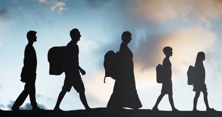 Silhouetted figures walking in a line, to represent Refugee Week