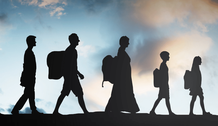 Silhouetted figures walking in a line, to represent Refugee Week