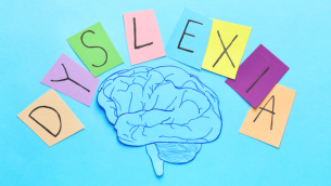 Letters spelling dyslexia above illustration of brain for Dyslexia Awareness Week