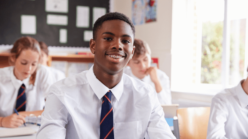 Teenage boy in classroom at desk