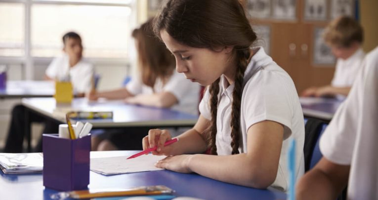 Schoolgirl doing reading comprehension activities