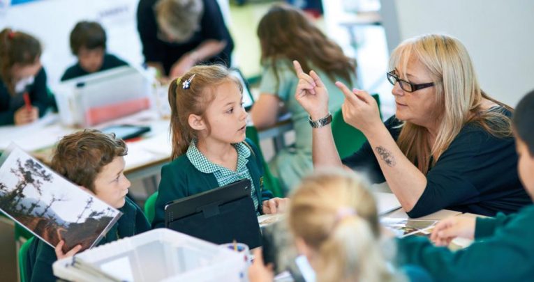 Children in classroom doing guided reading