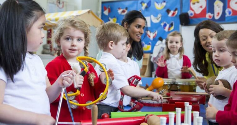 Children joining in with music national curriculum activities