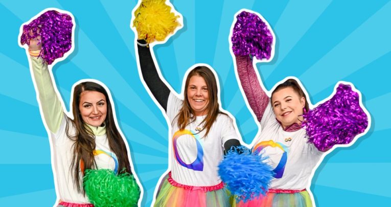 Three women cheerleading for Autism Awareness Week