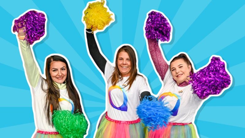 Three women cheerleading for Autism Awareness Week