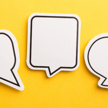 Paper speech bubbles on yellow background, representing stammering in children