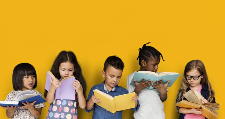 Five children reading, representing KS1 reading comprehension