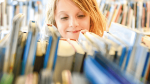 Child browsing school library