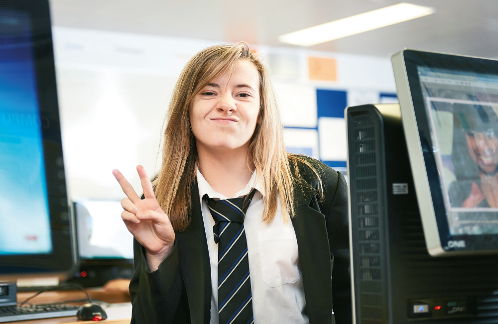 Teenage schoolgirl in computer lab, representing women in STEM