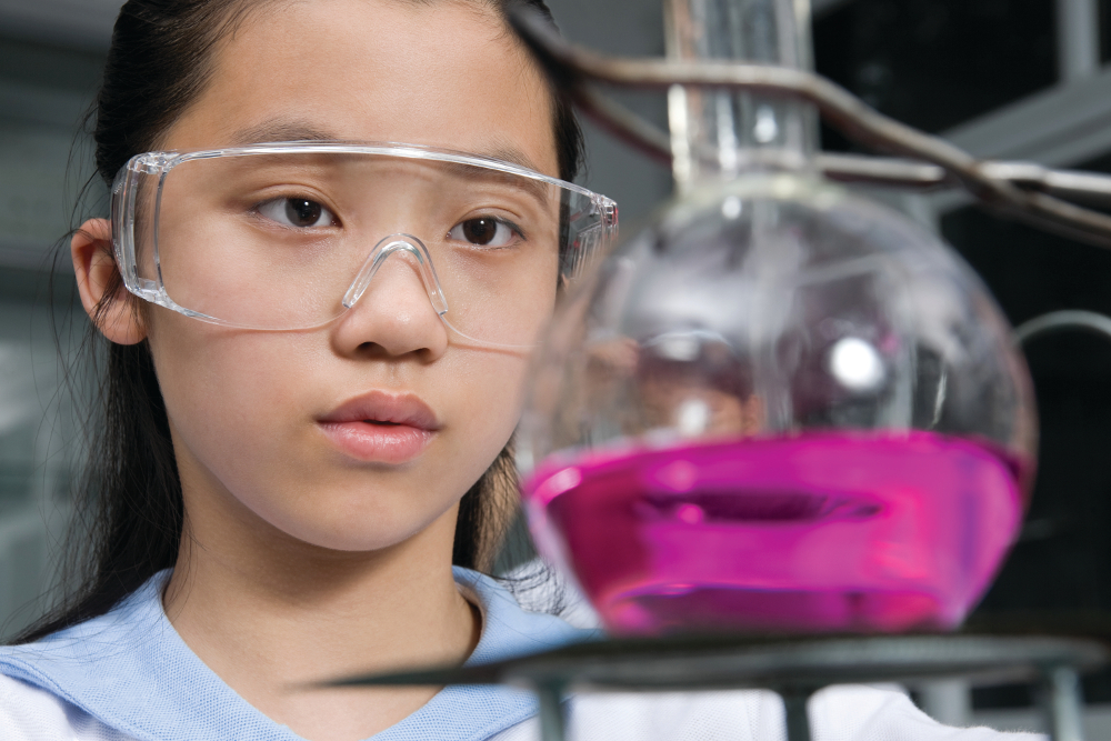 Schoolgirl in science lab