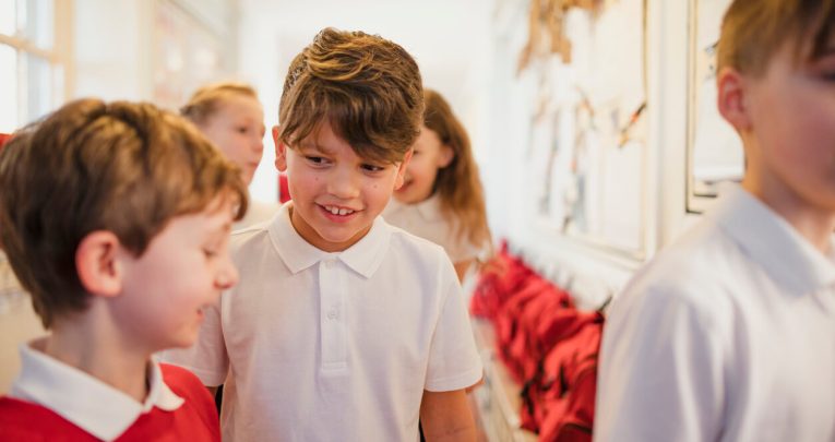 Primary children talking in corridor