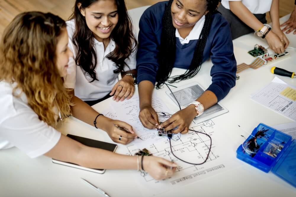 Schoolgirls taking part in STEM project, representing women in STEM