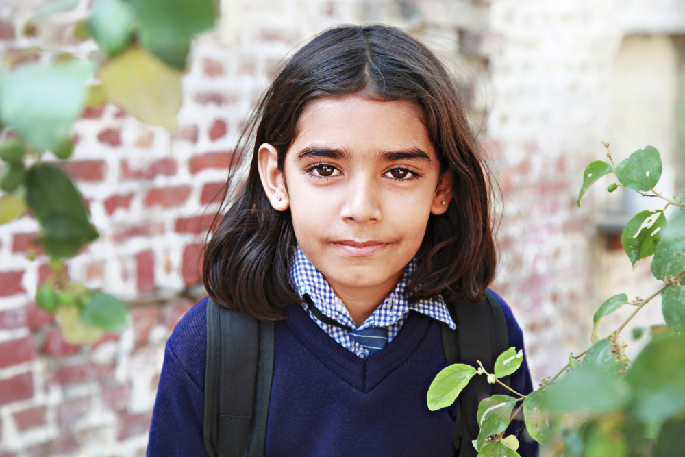 Girl with undiagnosed autism in school uniform