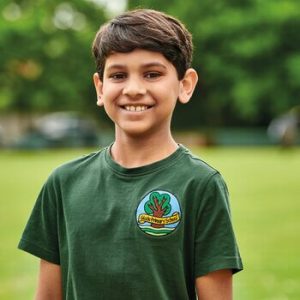Boy in green t-shirt smiling