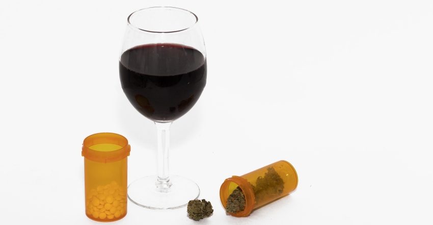 photograph of glass of wine and cannabis to illustrate concept of drugs and alcohol education