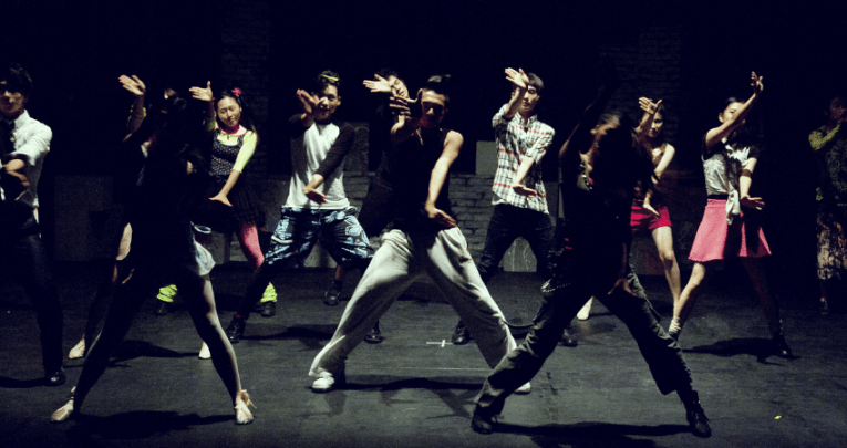 Dances on stage representing cultural capital in education