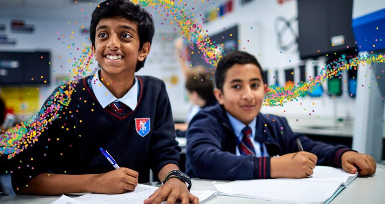 Two secondary school pupils smiling