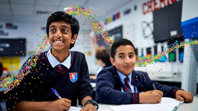 Two secondary school pupils smiling