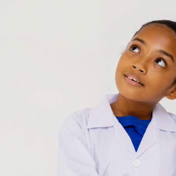 Girl in lab coat on science trip