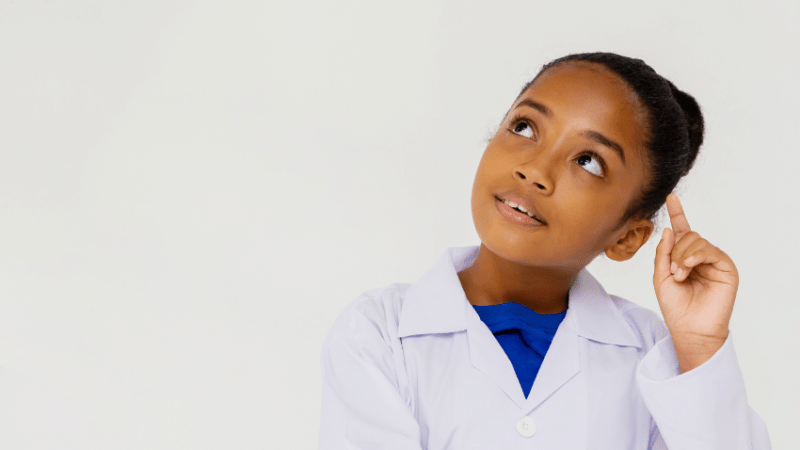 Girl in lab coat on science trip