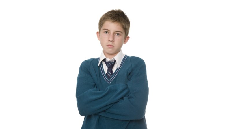 Photo of an expressionless teenage boy