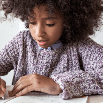 Child doing creative writing