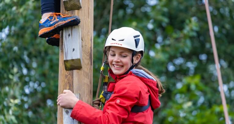 A student climbing at Skern Lodge
