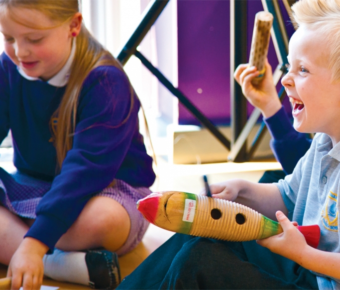 Primary school children playing instruments