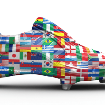 Flag covered football boot representing 2022 FIFA World Cup