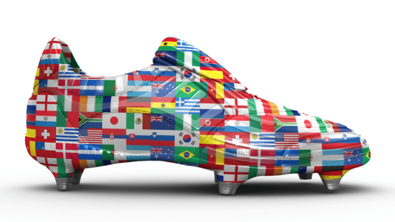 Flag covered football boot representing 2022 FIFA World Cup