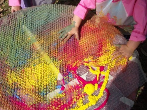 Reggio Emilia approach activity idea involving covering bubble wrap with paint