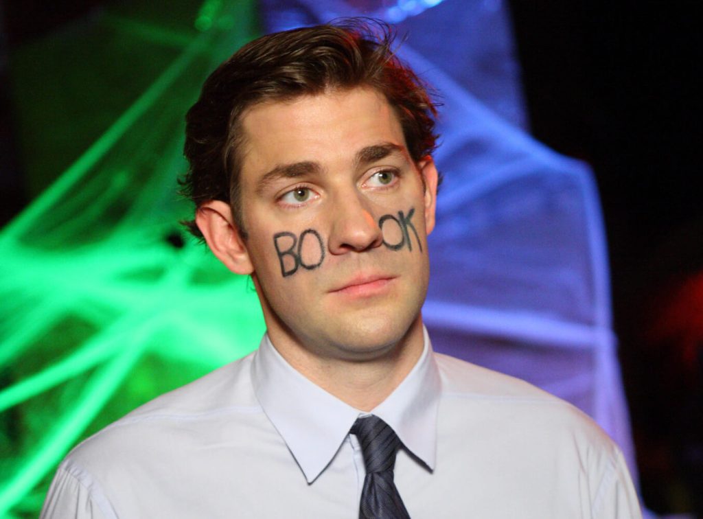 Jim Halpert with 'BOOK' written on his face