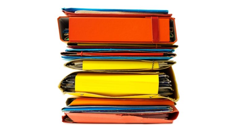 isolated stack of colourful document storage files