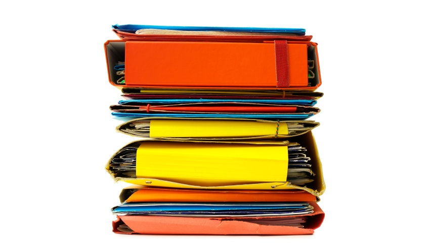 isolated stack of colourful document storage files