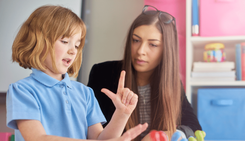 Girl in school uniform counting on fingers