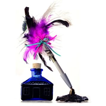 close-up photograph of a quill and an ink bottle